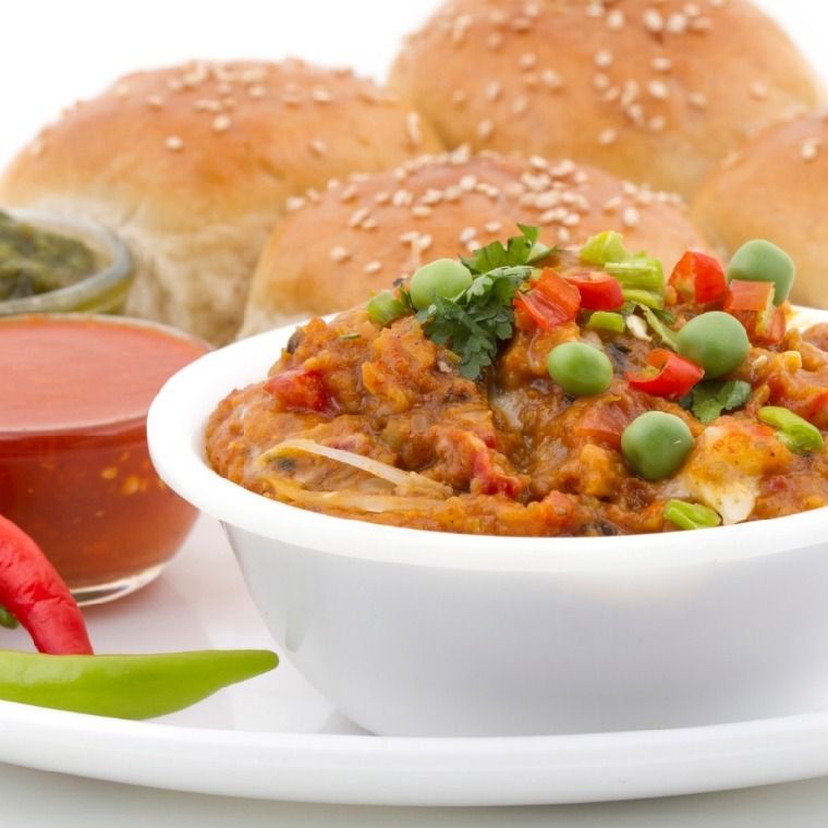 Close-up of a Vegetable Tandoori dish with vibrant colors and garnishes.